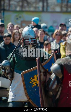 Barnaul - April 22, 2017: Medieval restorers fight with swords in armor at a knightly tournament, historical restoration of knightly fights on April 2 Stock Photo