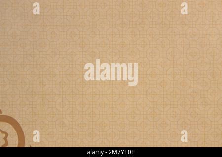 Image of a surface with geometric decoration in brown tones with copy space and a small decoration in a corner Stock Photo