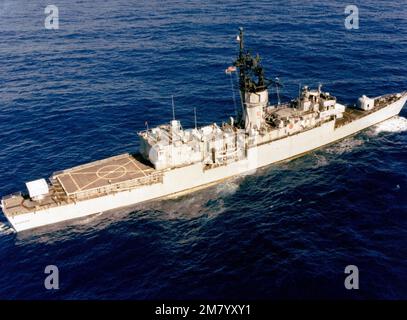 Aerial starboard quarter view of the Knox class frigate USS BADGER (FF-1071) underway. Country: Pacific Ocean (POC) Stock Photo