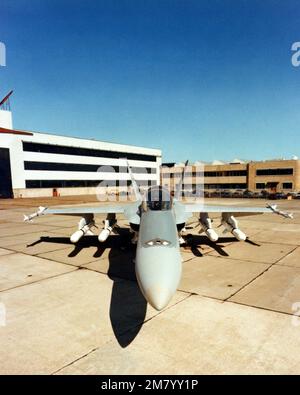 Front view of a parked F/A-18 Hornet aircraft armed with four wing mounted AGM-84 Harpoon missiles (underneath the wings) and an AIM-9 Sidewinder air-to-air missile on each wingtip. Country: Unknown Stock Photo