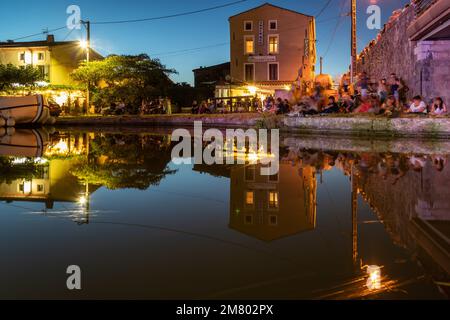 NIGHT OVER THE PORT OF HOMPS  IN THE EVENING OF BASTILLE DAY WITH A BLUE LIGHT, AUDE, OCCITANIE, FRANCE Stock Photo