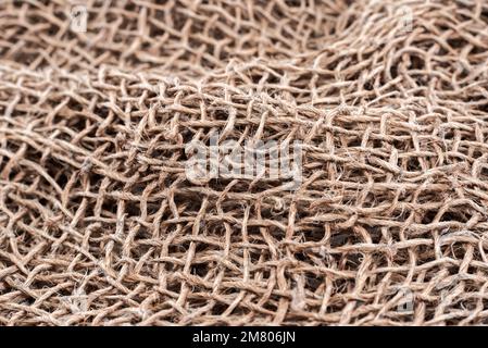 Cloth. The texture of the burlap fabric is close-up. Packaging material. Background Of Burlap Hessian SackingCloth. The texture of the burlap fabric i Stock Photo