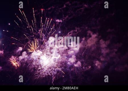 Bright light flash of fireworks, against the background of the night sky. High quality photo Stock Photo