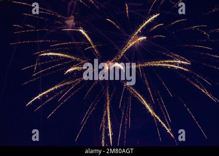 An explosion of bright single fireworks, against the background of the night sky. High quality photo Stock Photo
