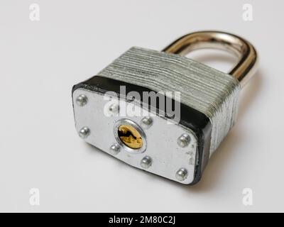 Locked padlock on white background. Stock Photo