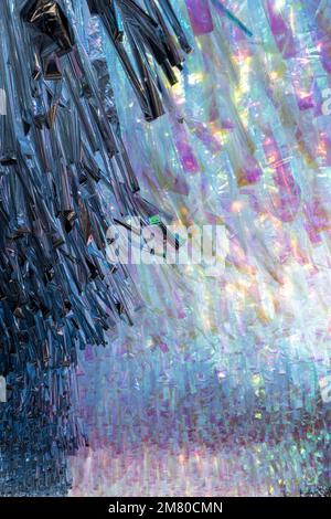 transparent holographic fabric, litmus paper hung in a hallway generating interesting shapes Stock Photo