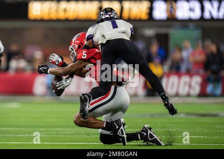 TCU Horned Frogs cornerback Tre'Vius Hodges-Tomlinson (1) is called for pass interference against Georgia Bulldogs wide receiver Adonai Mitchell (5) d Stock Photo