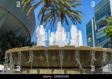 Anaheim, CA, USA – November 1, 2022: Small water fountain and palm trees at the Anaheim Convention Center in Anaheim, California. Stock Photo