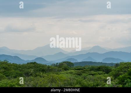 Layers of mountains in the haze in the Sierra Madre del Sur Mountains of Oaxaca, Mexico. Stock Photo