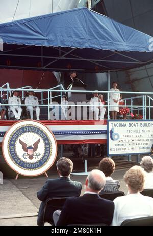 Frank B. Lynott, Chairman of the Tacoma Boat Building Company and master of ceremonies, introduces Josephine Kerr Zech, sponsor and wife of Vice Admiral Lando W. Zech Jr., during the launching ceremony for the ocean surveillance ship USNS STALWART (T-AGOS 1). Base: Tacoma State: Washington (WA) Country: United States Of America (USA) Stock Photo