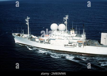 An aerial port view of the missile range instrumentation ship USNS OBSERVATION ISLAND (T-AGM 23) underway off the coast Hawaii. Country: Pacific Ocean (POC) Stock Photo