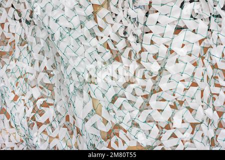 Winter camouflage netting for soldiers of the Ukrainian army Stock Photo