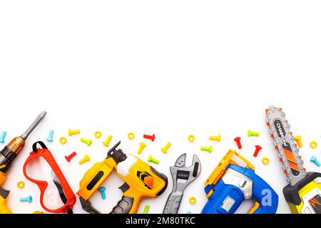 Colorful kids toy tools on white background. Flat lay. Copy space for text Stock Photo