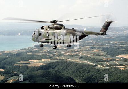 An air-to-air left side view of an HH-3E helicopter assigned to the 33rd Aerospace Rescue and Recovery Squadron, Kadena Air Base, Japan. Country: Unknown Stock Photo