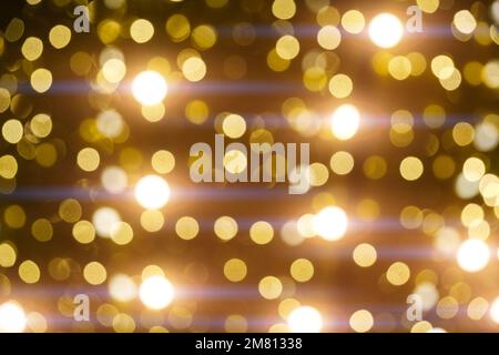 Abstract bright background, bokeh of burning yellow light bulbs Stock Photo