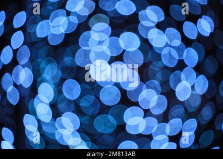 Abstract bright background, bokeh of burning blue light bulbs Stock Photo