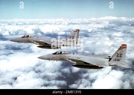 An air-to-air left side view of two F-15 Eagle aircraft during a mission for the joint Japanese Air Self Defense Force (JASDF) and US Air Force exercise COPE NORTH 84-1. The aircraft are assigned to the 67th Tactical Fighter Squadron, 18th Tactical Fighter Wing, Kadena Air Base, Japan. Subject Operation/Series: COPE NORTH 84-1 Country: Japan (JPN) Stock Photo