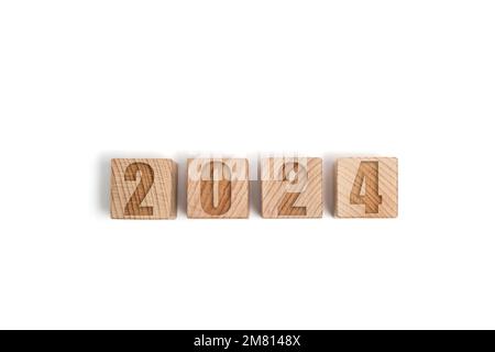 Wooden cubes with numbers 2024, white background Stock Photo