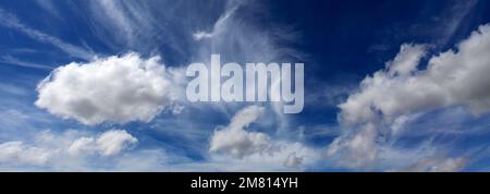 Cumulus humilis clouds in a deep blue sky. Stock Photo