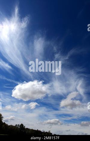Cumulus humilis clouds in a deep blue sky. Stock Photo