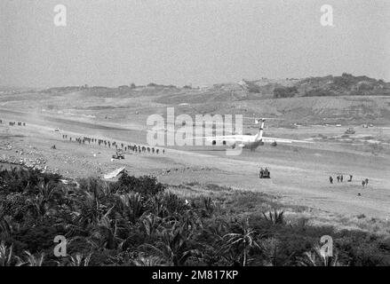 A C-141B Starlifter aircraft prepares for takeoff on the ramp at Pago ...