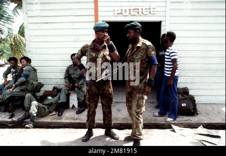 Members of the Eastern Caribbean Defense Force in front of the police building during Operation URGENT FURY. Subject Operation/Series: URGENT FURY Country: Grenada (GRD) Stock Photo