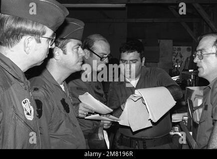 US Air Force personnel are briefed on Cuban documents seized during the multiservice, multinational Operation URGENT FURY. Subject Operation/Series: URGENT FURY Country: Grenada (GRD) Stock Photo