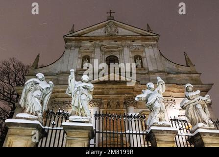 Krakow Church - the entrance to the Church of Saints Peter and Paul, a baroque catholic church, in the snow in winter; Krakow Poland Europe Stock Photo