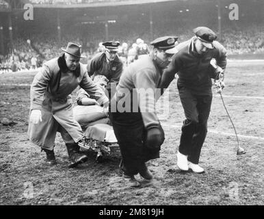 Detroit Lions quarterback Bobby Layne is carried off the field at