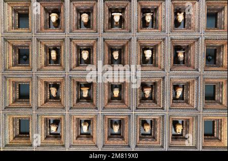 Some of the thirty carved heads on the coffered ceiling of the Envoys Hall, Wawel Castle interior, 15th century; Krakow Old Town, Krakow Poland Europe Stock Photo