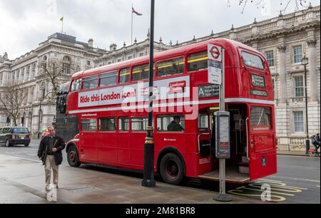 London. UK- 01.08.2023. The rear view of a the iconic old Routemaster  double decker bus working as a tourist ride in Westminster. Stock Photo