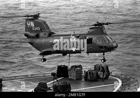 Right side view of a UH-46 Sea Knight helicopter providing replenishment service to ships positioned off the coast of Lebanon. The ships are supporting US Marines assigned to the multinational peacekeeping force in Beirut. Country: Mediterranean Sea (MED) Stock Photo