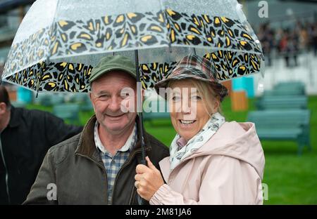 Ascot, Berkshire, UK. 2nd October, 2021. Racegoers with their umbrellas enjoying racing at Ascot. Credit: Maureen McLean/Alamy Stock Photo