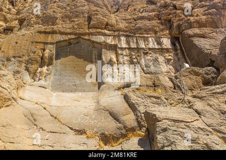 BISOTUN, IRAN - JULY 13, 2019: Safavid inscription in Mithradata (Mithridates) II and Godarz (Gotarzes) II reliefs in Bisotun, Iran Stock Photo