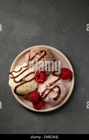 Ice cream ball with strawberry pieces Stock Photo by magone