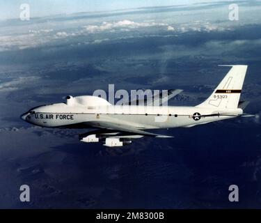 An air-to-air left side view of an NKC-135 Airborne Laser Laboratory aircraft. The aircraft is used by the US Air Force Weapons Laboratory and the Defense Advanced Research Projects Agency (DARPA) to investigate High Energy Laser (HEL) systems. Country: Unknown Stock Photo