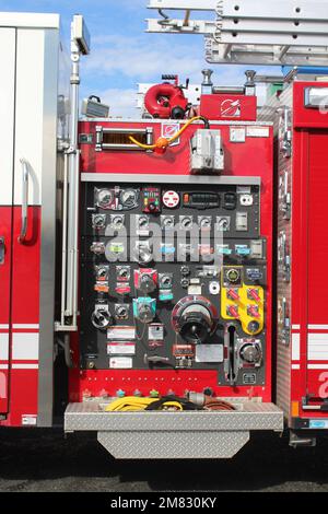 Closeup of American fire engine hose valve and connector panel Stock Photo