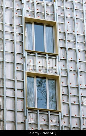 thermal insulation of apartment building facade. energy efficiency house wall renovation for energy saving.