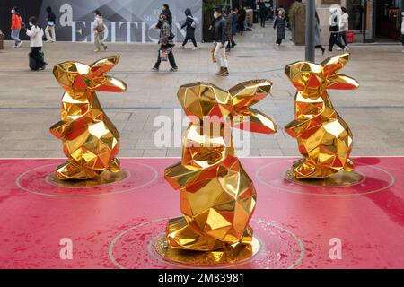 SHANGHAI, CHINA - JANUARY 12, 2023 - More than 10 'golden rabbits' are seen on Nanjing Road pedestrian street in Shanghai, China, January 12, 2023. Stock Photo