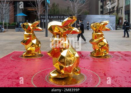 SHANGHAI, CHINA - JANUARY 12, 2023 - More than 10 'golden rabbits' are seen on Nanjing Road pedestrian street in Shanghai, China, January 12, 2023. Stock Photo