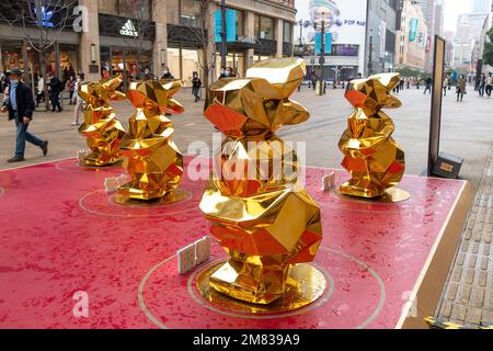 SHANGHAI, CHINA - JANUARY 12, 2023 - More than 10 'golden rabbits' are seen on Nanjing Road pedestrian street in Shanghai, China, January 12, 2023. Stock Photo