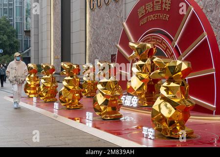 SHANGHAI, CHINA - JANUARY 12, 2023 - More than 10 'golden rabbits' are seen on Nanjing Road pedestrian street in Shanghai, China, January 12, 2023. Stock Photo