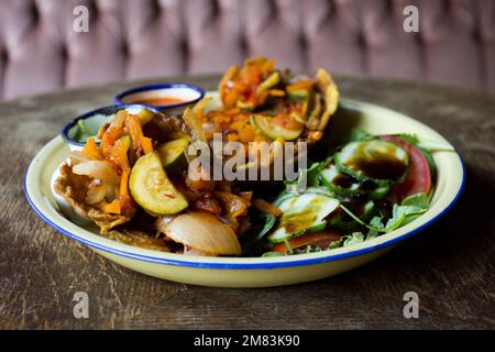 Patacón breakfast. The patacón, tostón, tachino or frito is a meal based on fried flattened pieces of green plantain Stock Photo