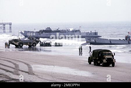 An LCM 8 Mod 1 mechanized landing craft carries an M60A1 main battle ...