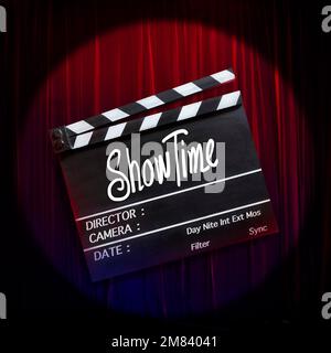 Showtime.Handwriting on film slate.storytelling inspiration.Broadway theatre, show performance in the background. Stock Photo