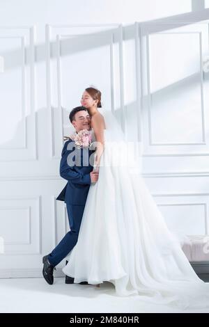 Happy and sweet bride and groom Stock Photo - Alamy
