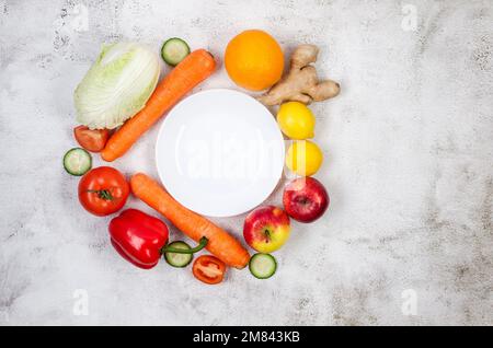 Seasonal Fresh fruit and vegetables on grey background, Vegetarian and vegan diet. Sustainable lifestyle, good, real plant-based foods. Veganuary conc Stock Photo