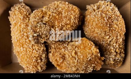 Breading chicken legs Stock Photo