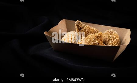 Breading chicken legs Stock Photo