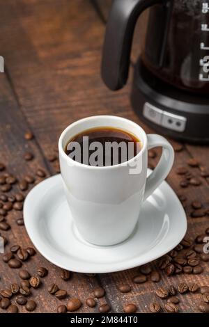 Filter coffee brewed in a filter coffee machine in a white porcelain cup Stock Photo
